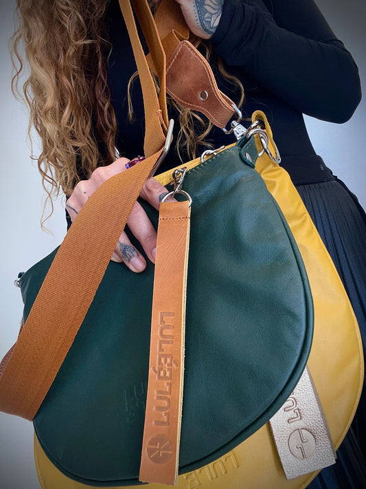 Duo Bag Yellow & Green — close-up of two-tone leather crossbody bag with embossed LULÉ LULÉ logo and tan strap | LULÉ LULÉ