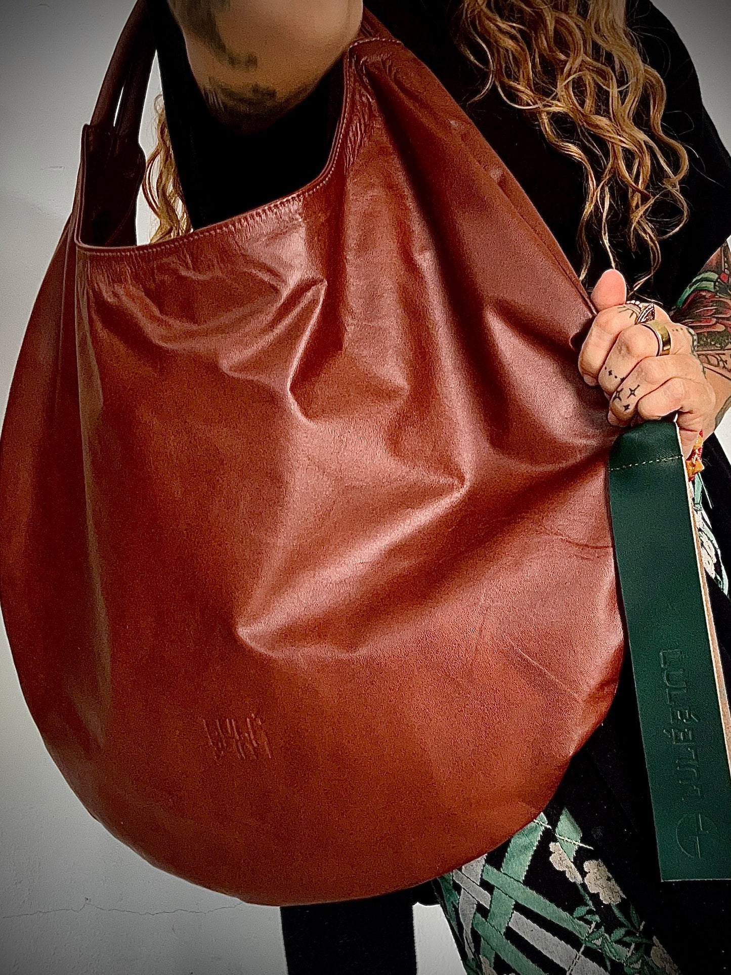 LULÉ LULÉ O.G. Bag terracotta leather hobo bag, front view worn on shoulder